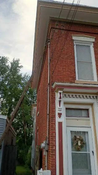 Door surround and trim painted on a brick row house