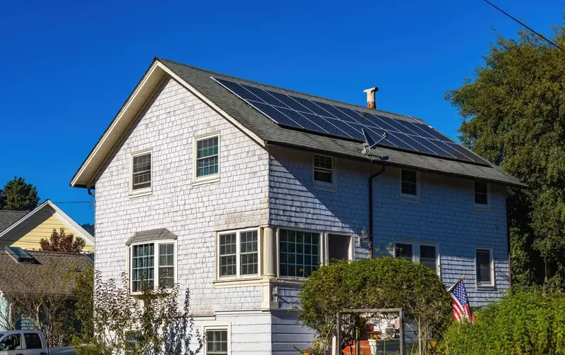 Two-story Central New York home with a treated asphalt shingle roof
