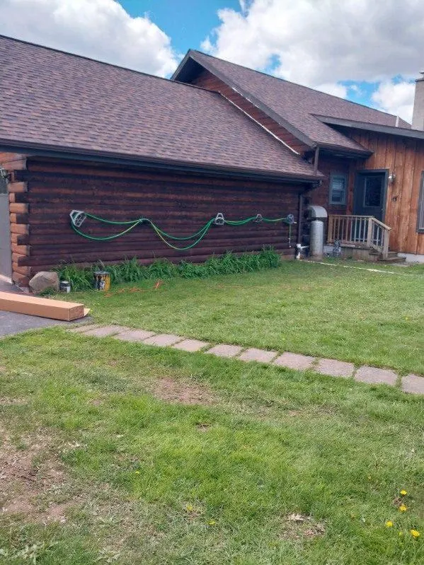 Siding work on a log-style ranch home