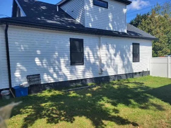 New white lap siding and trim on a home in Central New York