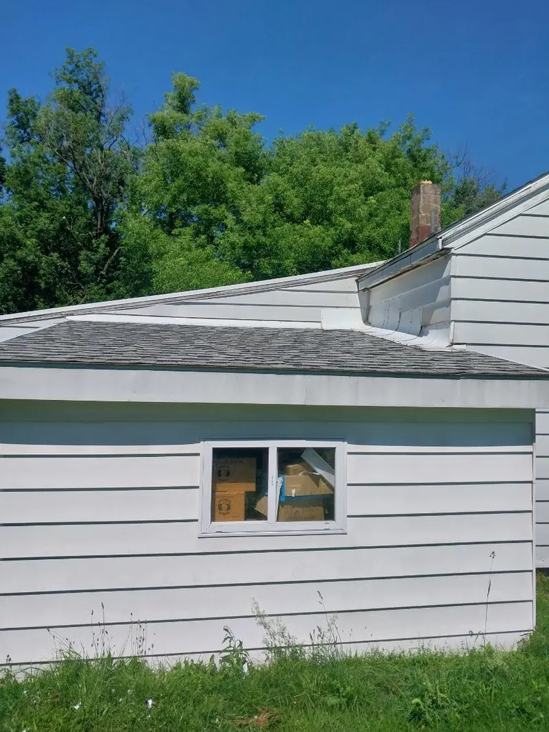 Siding and trim on a detached garage and breezeway